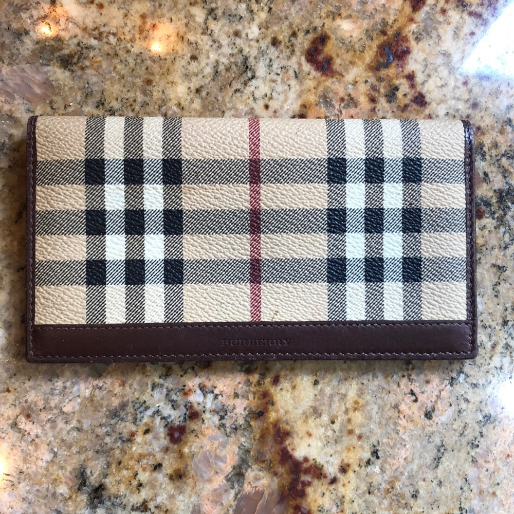 This beautiful Burberry Check case can be used for multiple uses.. like new